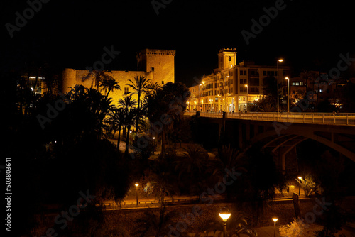Altamira castle or altamira palace and Basilica Santa Maria of Elche at night. Located in the Valencian community, Alicante, Elche, Spain.