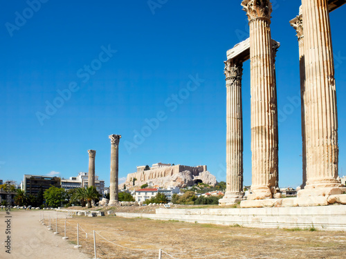 Corinthian order columns of the Olympian Zeus ancient temple, and Acropolis of Athens in the background