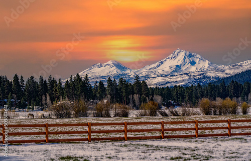 The Three Sisters mountains at Sunset viewed from Black Butte Ranch near town of Sisters in Central Oregon photo