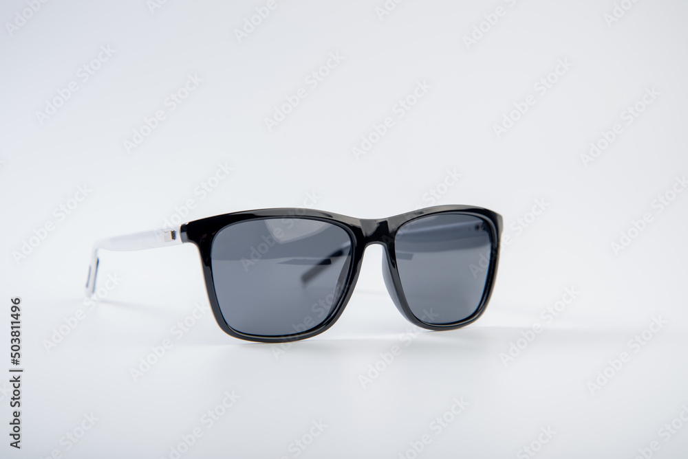 Sunglasses on white. Summer glasses. Fashion collection. Sunglasses for a tropical trip