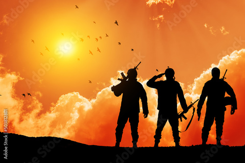 Silhouettes of soldiers against the sunrise. Concept - protection, patriotism, honor. Armed forces of Turkey, Israel, Egypt and other countries.