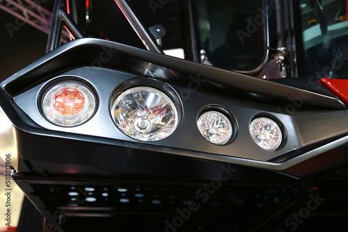 front headlights of a combine for harvesting crops