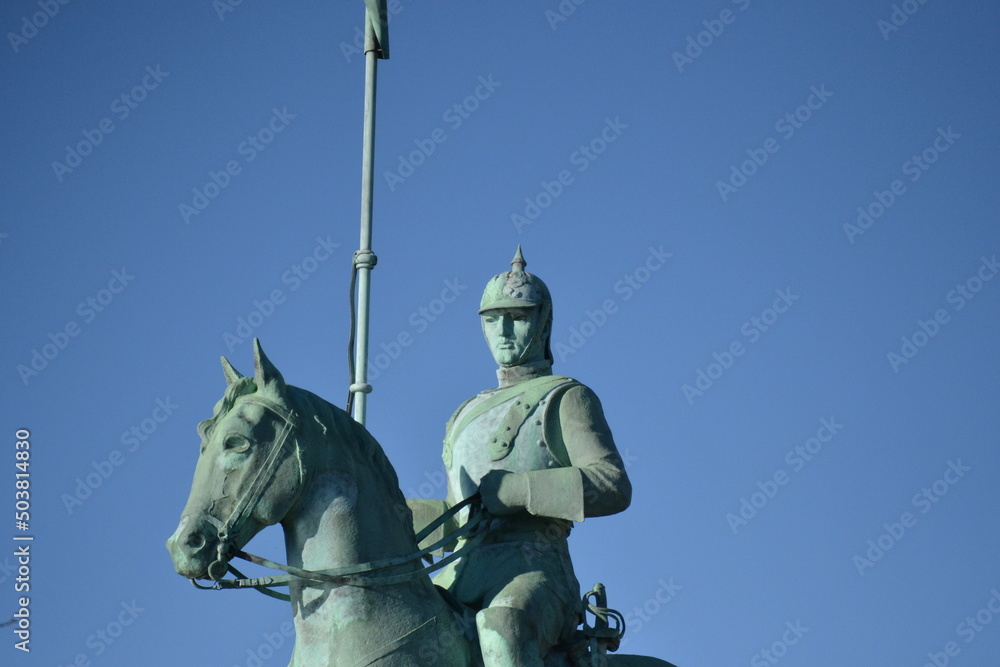 Cavalry soldier with pointed helmet on horseback