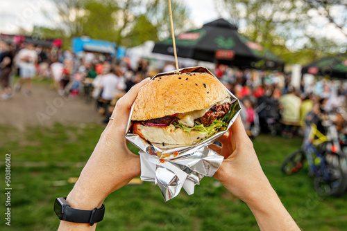 Eating burgers at an outdoor street food festival