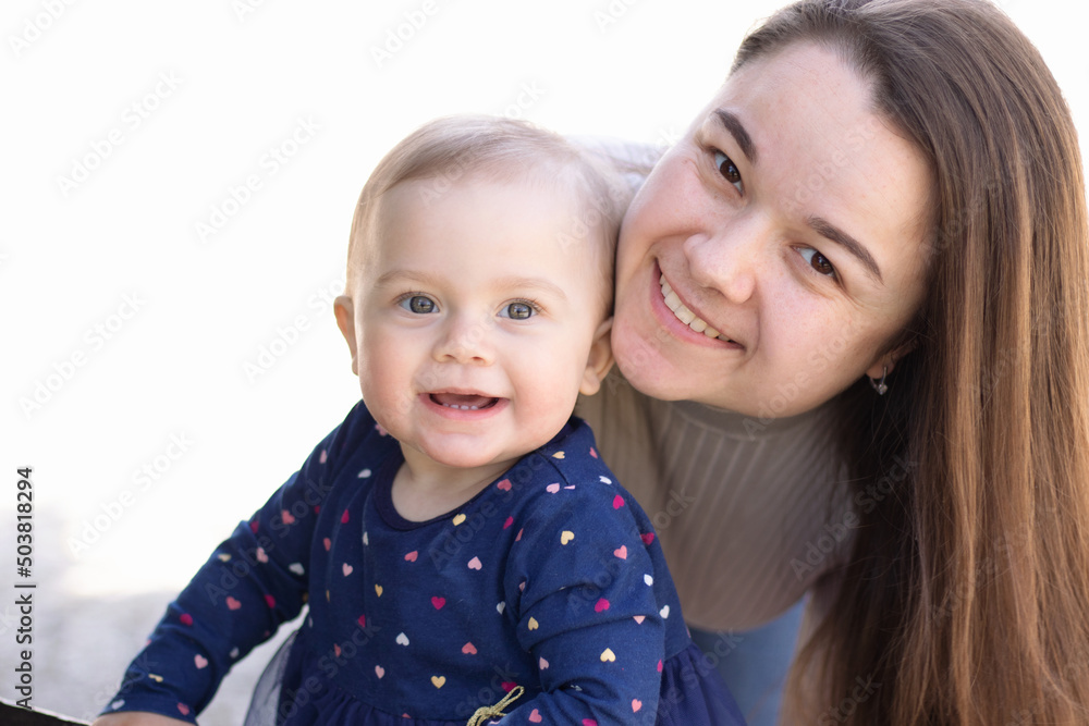 mother and daughter smiling outside mother and daughter smiling outside