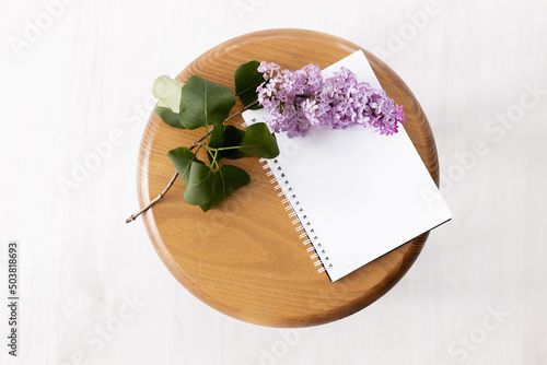 planner mockup with lilac. morning, craft envelope, blossom, flat lay, top view, notebook, lily pf the valley © ALEXSTUDIO