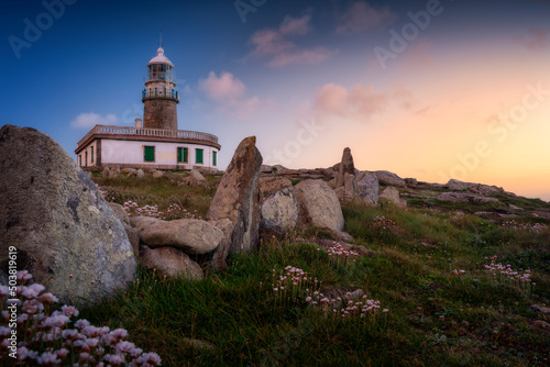 Lighthouse in Galicia during sunset. Spain photo