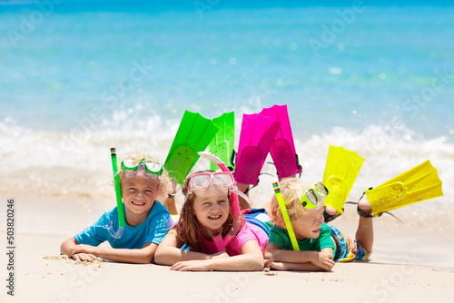 Kids snorkel. Children snorkeling in tropical sea. photo