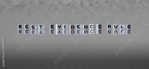 best evidence rule word or concept represented by black and white letter cubes on a grey horizon background stretching to infinity