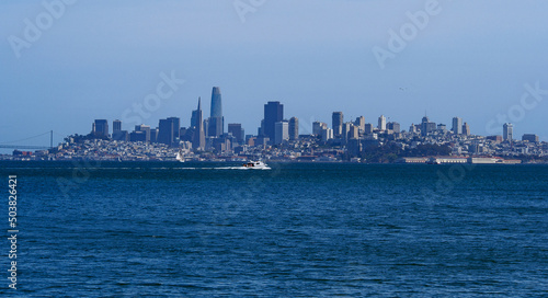 Bright blue water, San Francisco Skyline beneath a bright blue sky #503826421