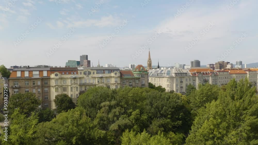Aerial view of Vienna in the rays of the setting sun. Heldenplatz, Rathaus, Volksgarden and university of Vienna skyline aerial shot. Cathedrals and cityscape City of Vienna, Austria. Aerial view of Vienna in the rays of the setting sun. Heldenplatz, Rathaus, Volksgarden and university of Vienna skyline aerial shot. Cathedrals and cityscape City of Vienna, Austria.