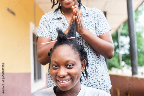 closeup image of a young black girl having a long black hair