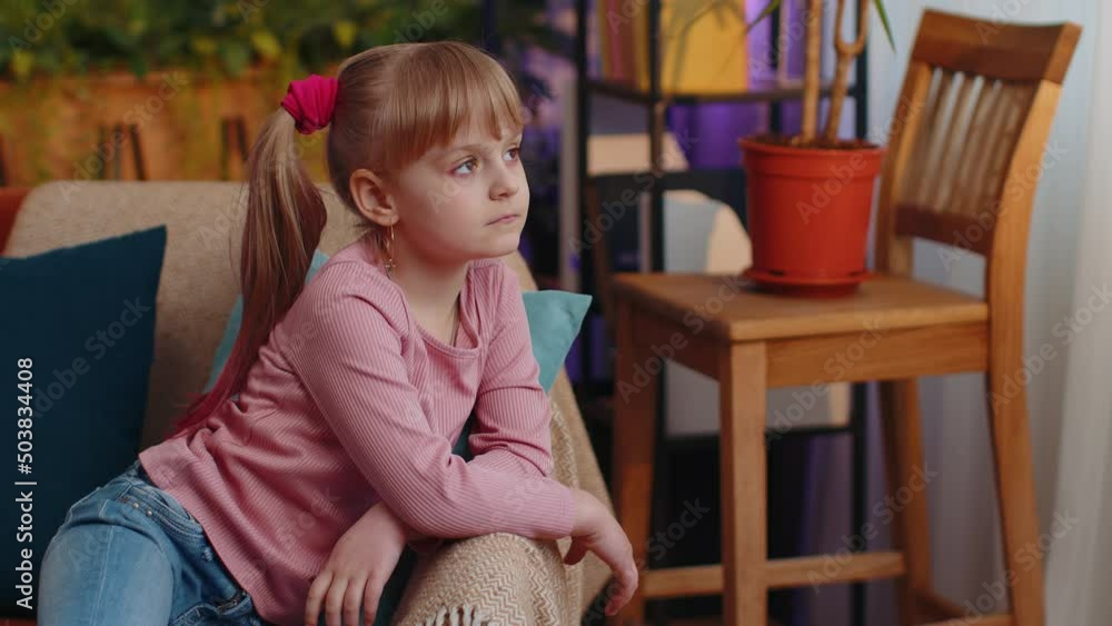 Sad little teen child girl looks pensive thinks over life concerns, suffers from unfair situation, divorce of parents, bullying. School toddler kid at home alone. Problem depressed feeling bad annoyed Sad little teen child girl looks pensive thinks over life concerns, suffers from unfair situation, divorce of parents, bullying. School toddler kid at home alone. Problem depressed feeling bad annoyed