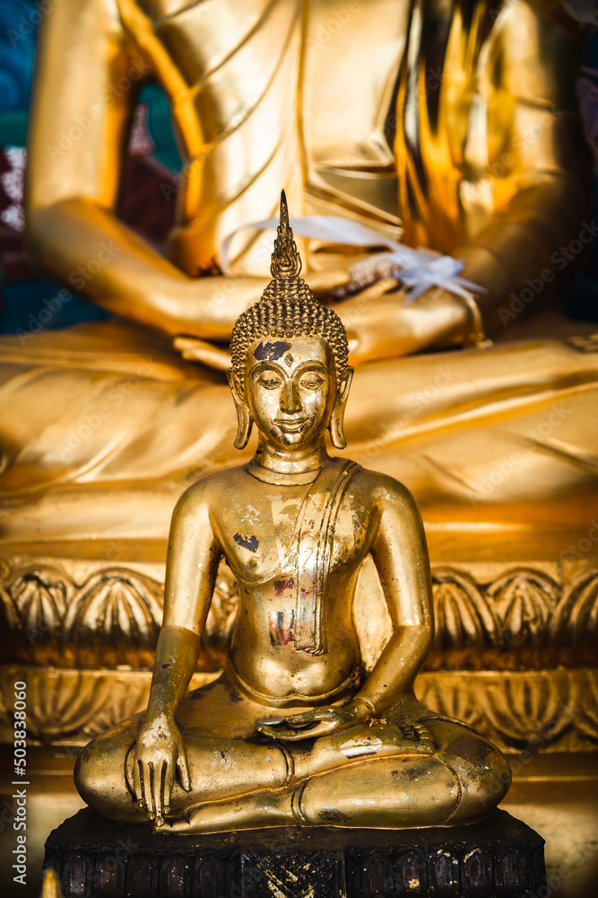 Old golden Buddha statue in a temple in Phitsanulok Province, Thailand. Old golden Buddha statue in a temple in Phitsanulok Province, Thailand.