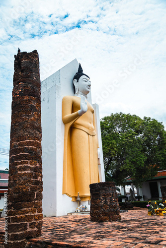 Old golden Buddha statue in a temple in Phitsanulok Province, Thailand.