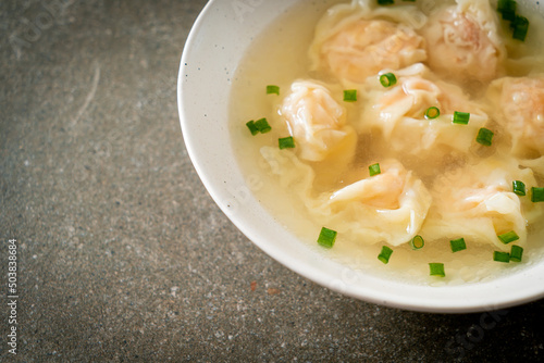 shrimp dumpling soup in white bowl