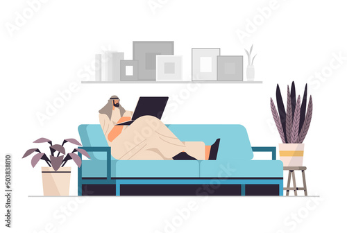 arab businessman freelancer working on laptop arabic business man using notebook on sofa social media network communication