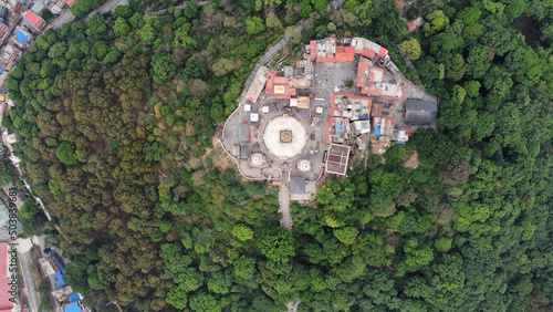 Aerial view of the Swayambhu religious complex in bright sunlight in Kathmandu, Nepal