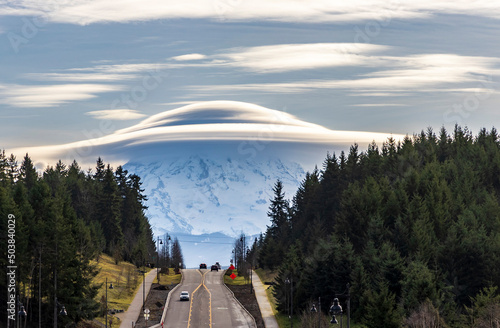 dramatic huge UFO shaped  lenticular cloud on top of Mt.Rainier in Washington.
