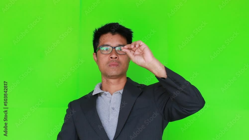 Portrait of businessman working on green screen background Portrait of businessman working on green screen background