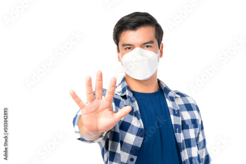 Stop Civid-19 , Man wearing Face Mask show stop hands gesture for stop corona virus outbreak , protect spread Covid-19 Coronavirus concept
