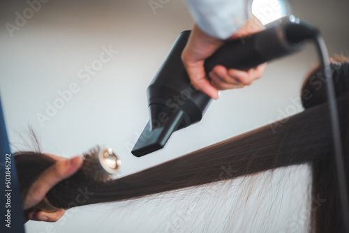 Obraz na płótnie concept of professional fashion hairdresser and hair beauty salon, hairstylist making treatment to woman client person, by using scissors for haircut and coiffure care, girl style in studio lifestyle w salonie