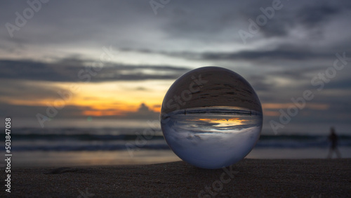 sunset view inside a crystal ball looks like no other. .4K Videos for beautiful and unusual travel ideas..time lapse the sun going  down to the sea..