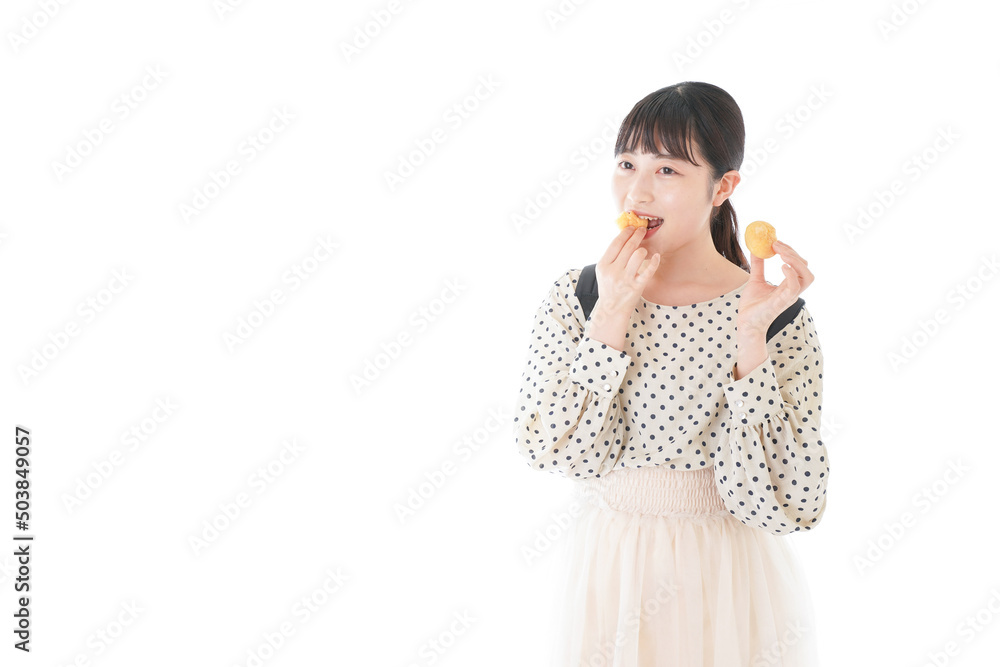 Young woman eating a snack