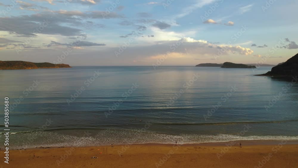 Sunset with rain clouds and atmosphere at Umina Beach on the Central Coast, NSW, Australia. Sunset with rain clouds and atmosphere at Umina Beach on the Central Coast, NSW, Australia.