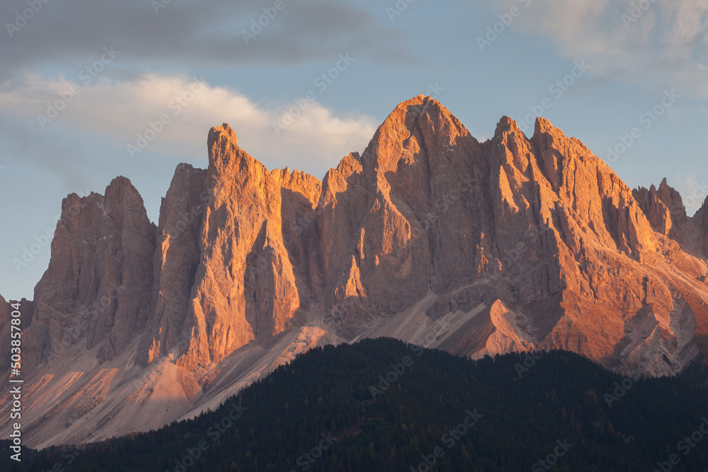 Detail of vertical Dolomites wall in Italy, at sunset