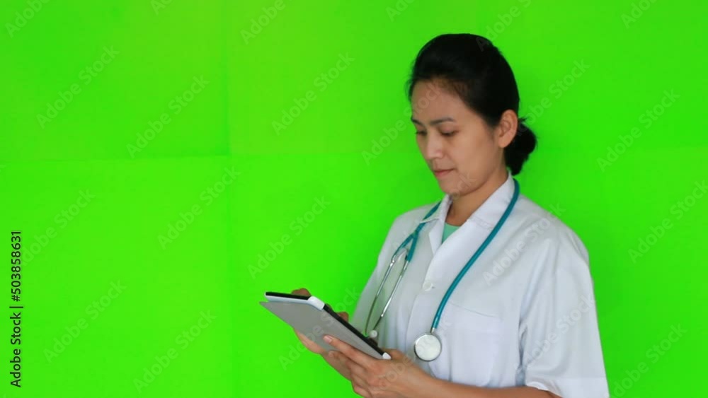 Portrait of doctor working on green screen background Portrait of doctor working on green screen background