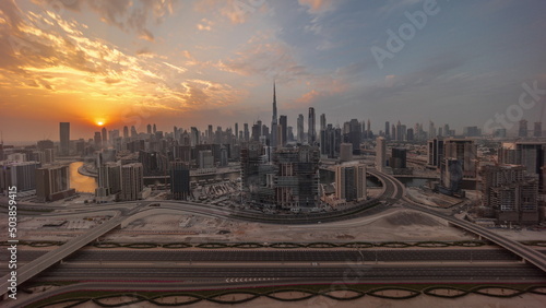 Sunset over panoramic skyline of Dubai with business bay and downtown district timelapse.