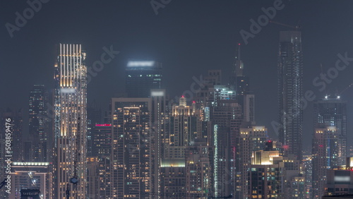 Panoramic skyline of Dubai with business bay and downtown district night timelapse. © neiezhmakov