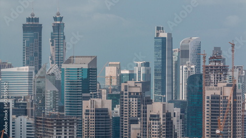 Skyline with modern architecture of Dubai business bay towers timelapse. Aerial view © neiezhmakov