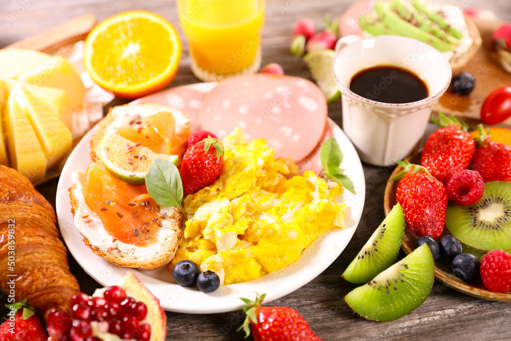health brunch with scrambled egg, fruits and coffee cup health brunch with scrambled egg, fruits and coffee cup