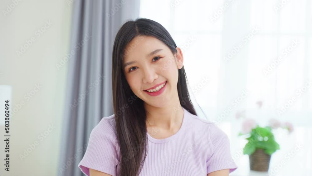 Portrait of Asian beautiful woman sit on sofa in living room at home. Portrait of Asian beautiful woman sit on sofa in living room at home.