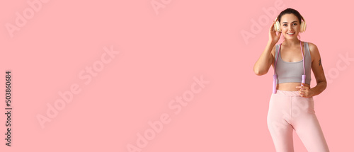 Sporty young woman with ski...