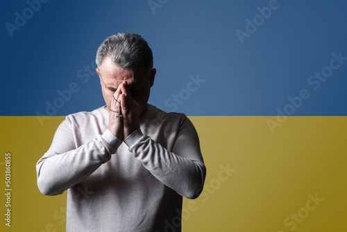 Portrait of praying mature ...