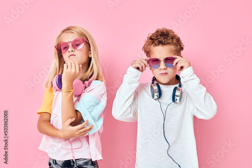 adorable little kids entertainment headphones playing studio posing