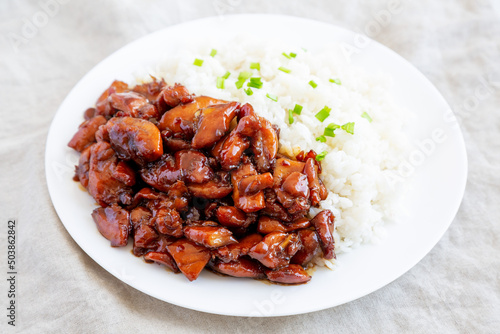 Homemade Teriyaki Chicken with White Rice on A Plate, side view.