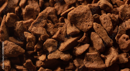 Instant coffee granules as background.