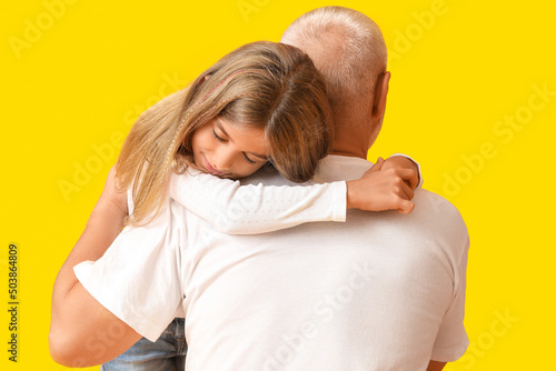 Little girl hugging her gra...