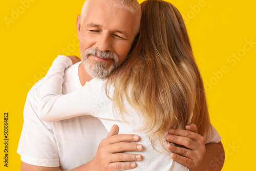 Senior man hugging his litt...