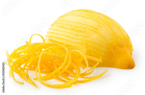 Half of peeled lemon next to heap of lemon zest. photo