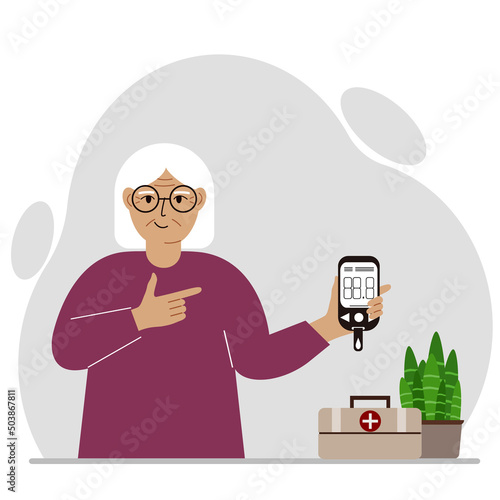 Happy old woman holds a glucometer in his hand. The concept of blood sugar control, diabetic.