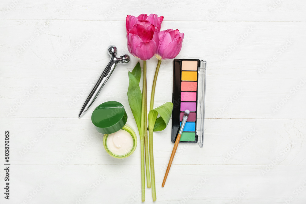 Bouquet of tulips and female accessories on white wooden background Bouquet of tulips and female accessories on white wooden background
