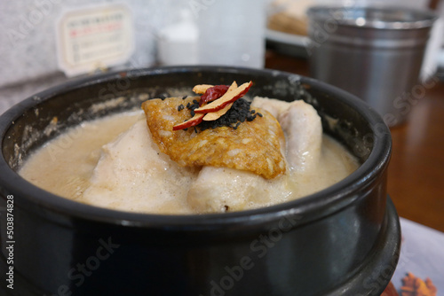 Samgyetang is a healthy Korean food made by boiling young chicken, ginseng, and jujube in an earthenware bowl.