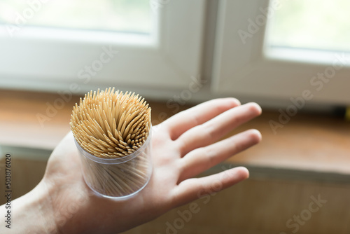 pack of toothpicks in hand photo