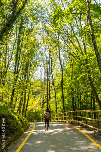 A young woman walking through the Pagoeta park in Aia, Gipuzkoa. Basque Country photo