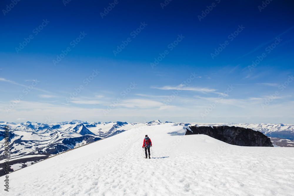 Extreme Sport. Lone hiker in winter mountains